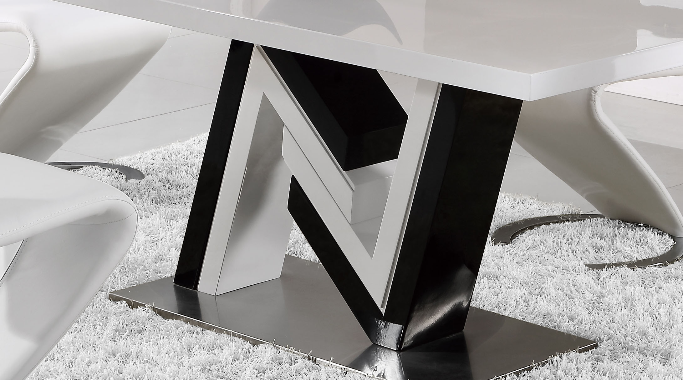 Unique Black and White Table with Curved White Leather Chairs Milwaukee